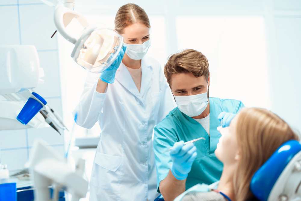 dentist nurse treat patient dental office (1)