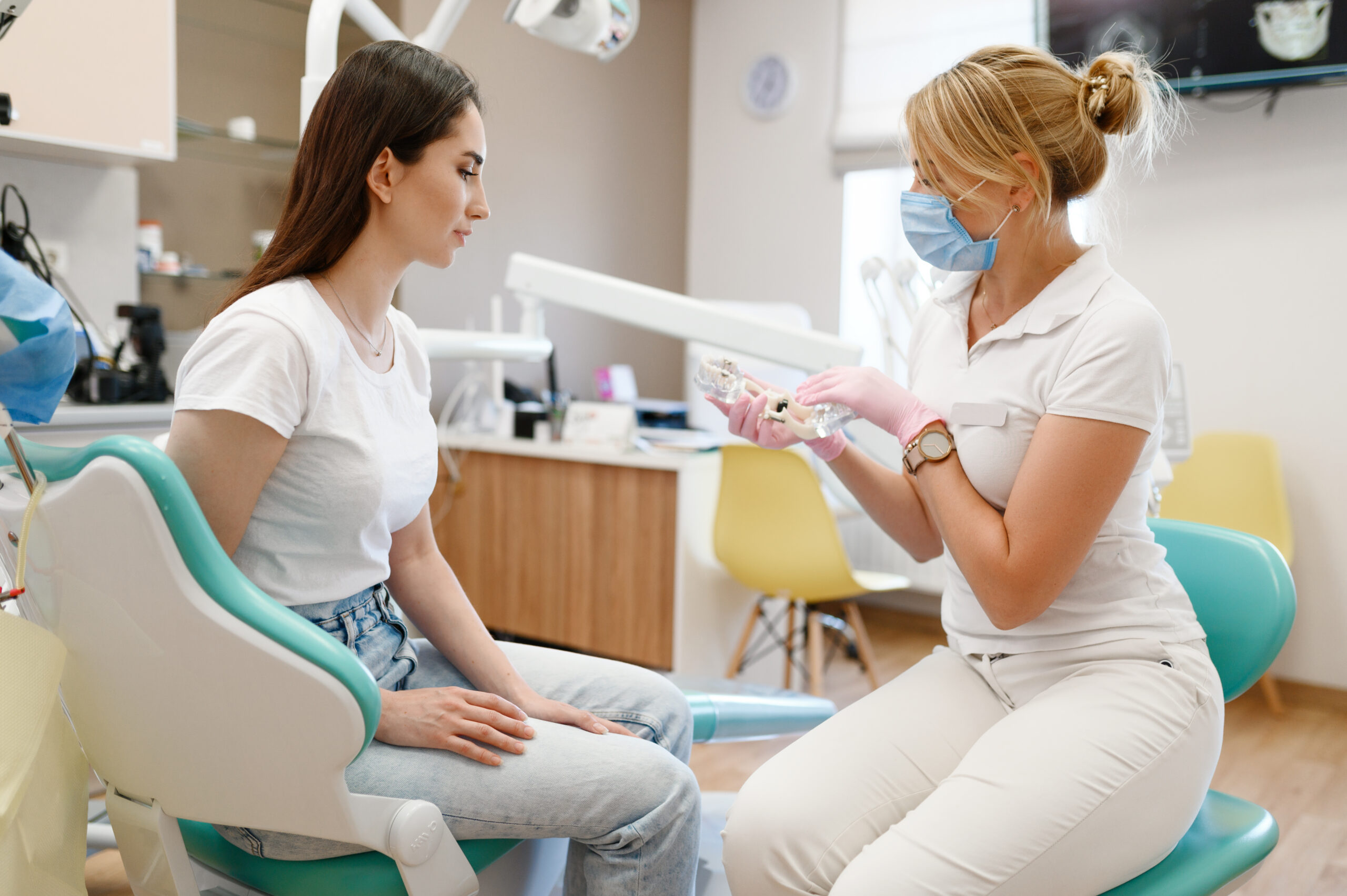 female dentist and patient, appointment in clinic